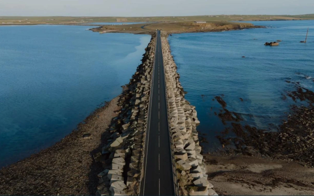 A road running along a stone causeway across the sea